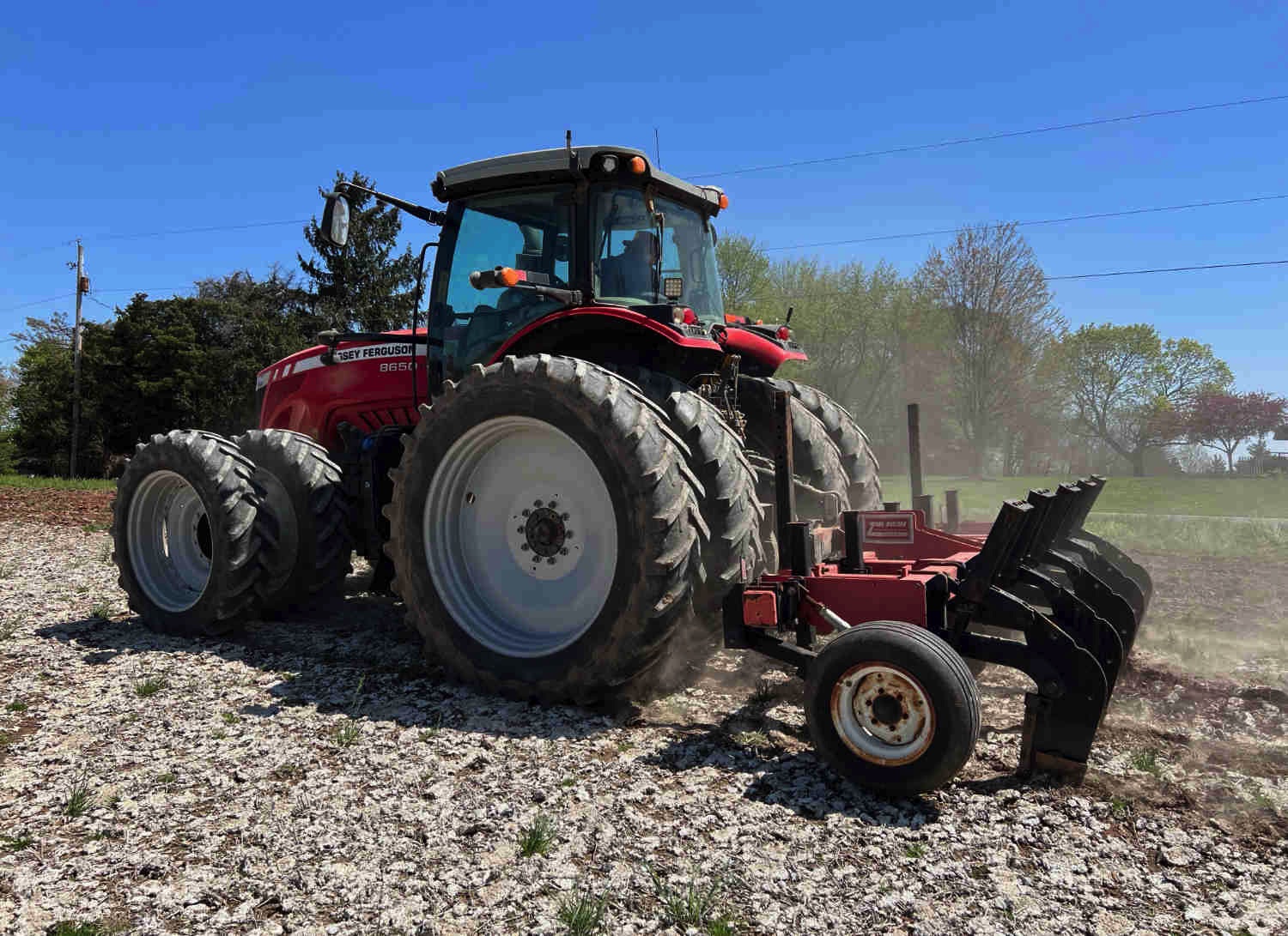 A picture of a large tractor farming.