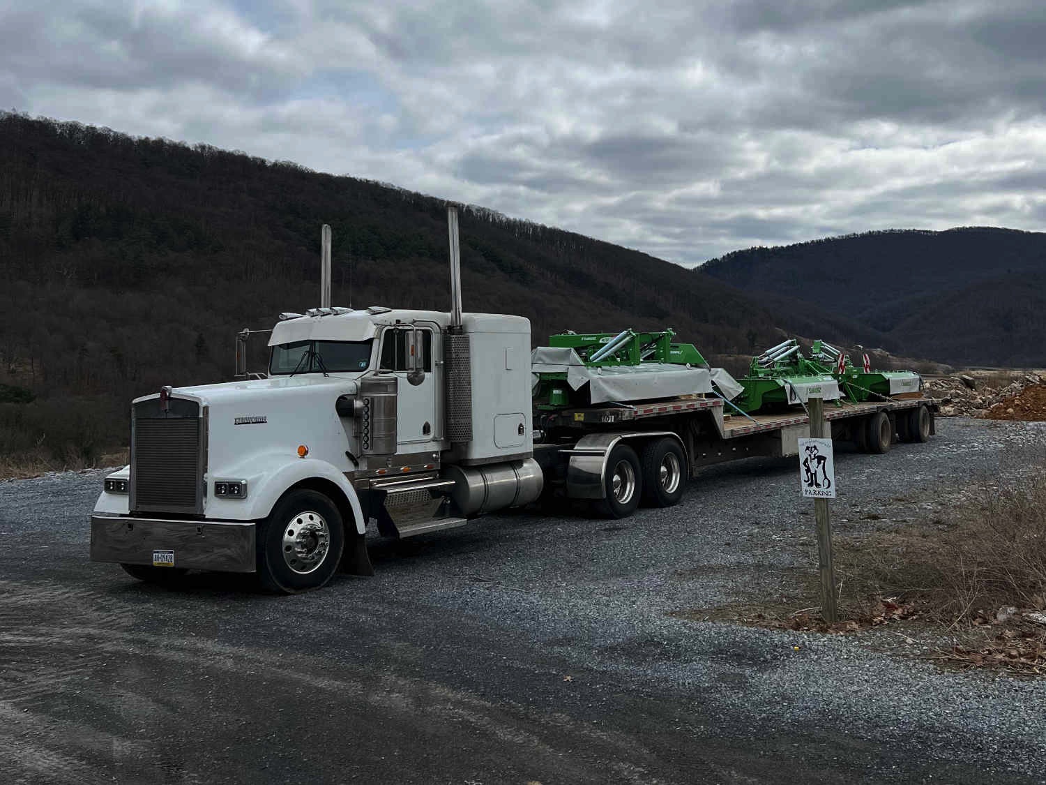 A picture of an American Truck trucking goods. 