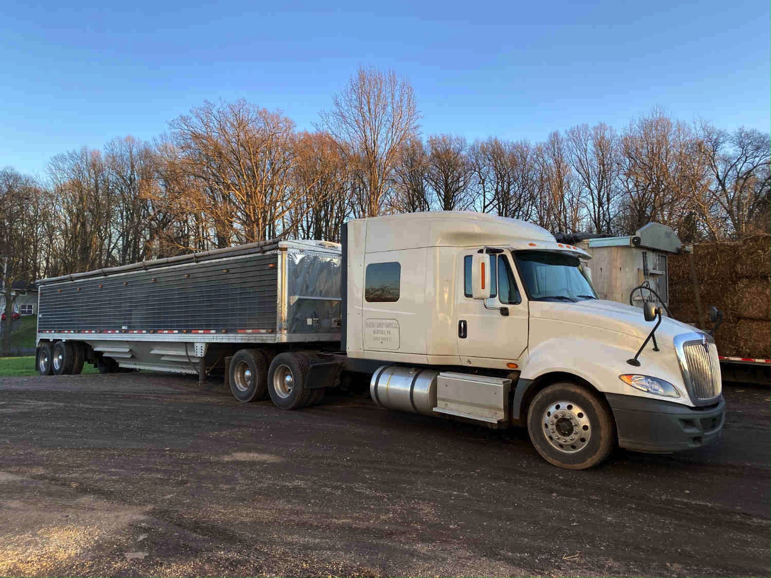 A picture of an American Truck hauling grain.